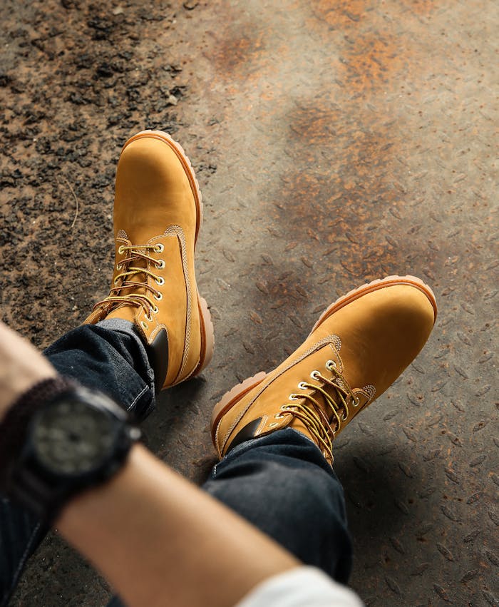 Crafting Captivating Headlines: Your awesome post title goes here Brown hiking boots on rugged surface, showcasing casual outdoor fashion.